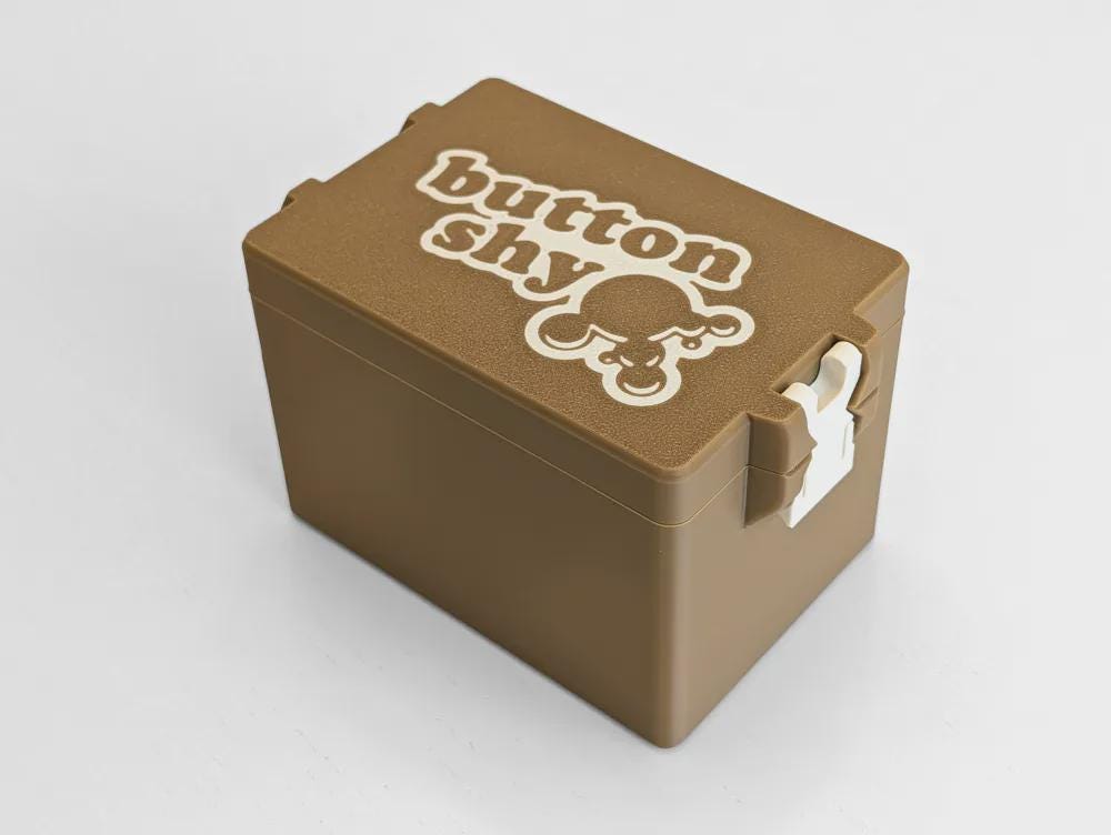 Button Shy - 5-6 Wallet Game Bin